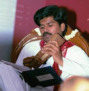 Sri Kaleshwar reading ancient manuscripts